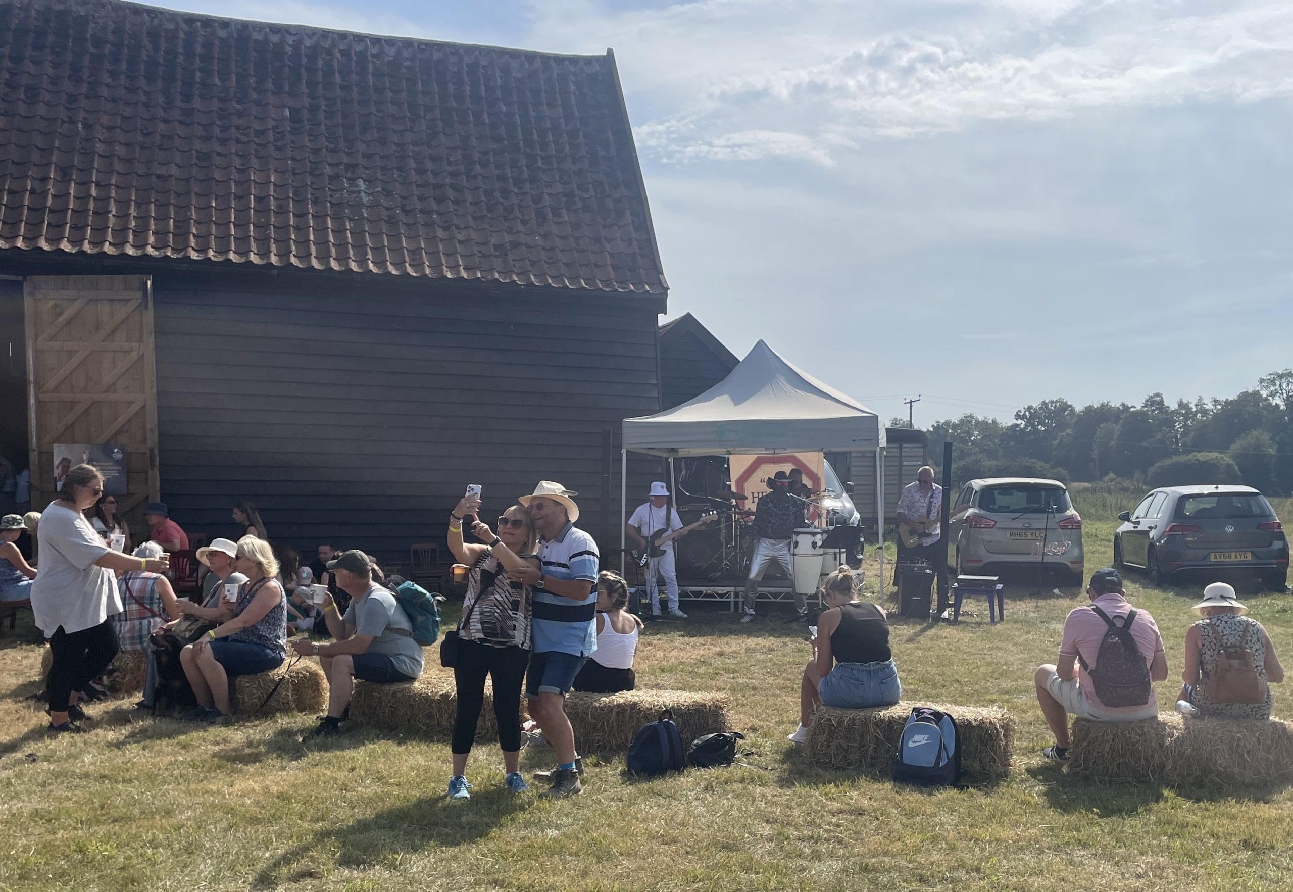 A small crowd watches a band perform